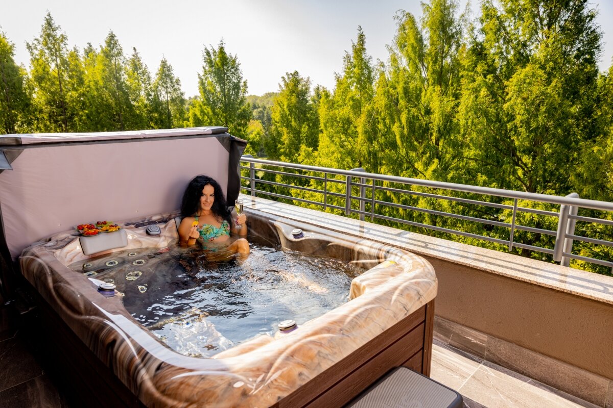Steaming warm bath water with lavender and rose petals, illustrating the AVTUB Method for peak relaxation.
