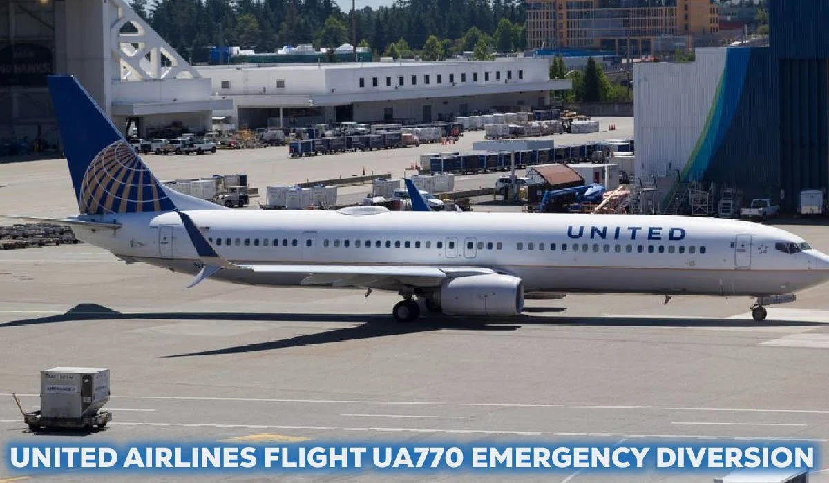 United Airlines Boeing 777-200ER touching down on a wet runway at Keflavík International Airport (KEF) with emergency vehicles (fire trucks) positioned nearby.