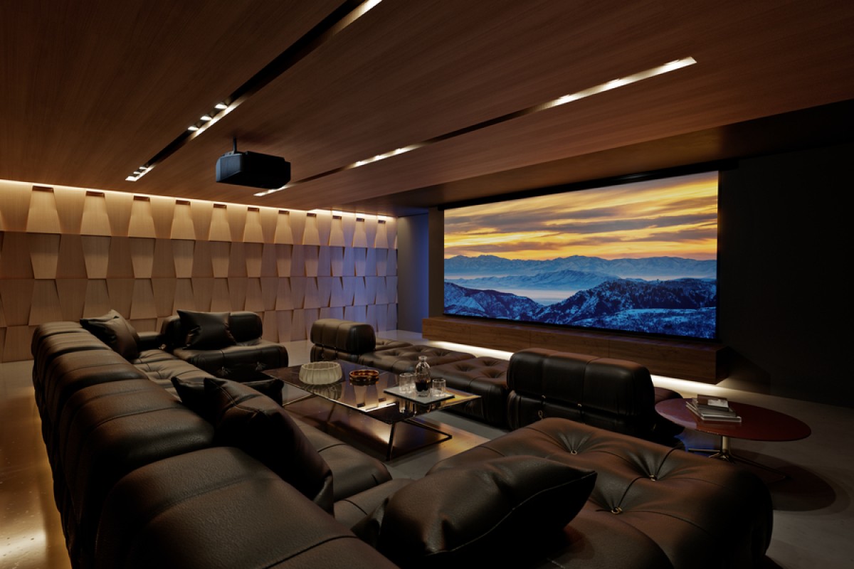 Custom home theater VIP box with tiered luxury leather seating, dark walls, and large screen.