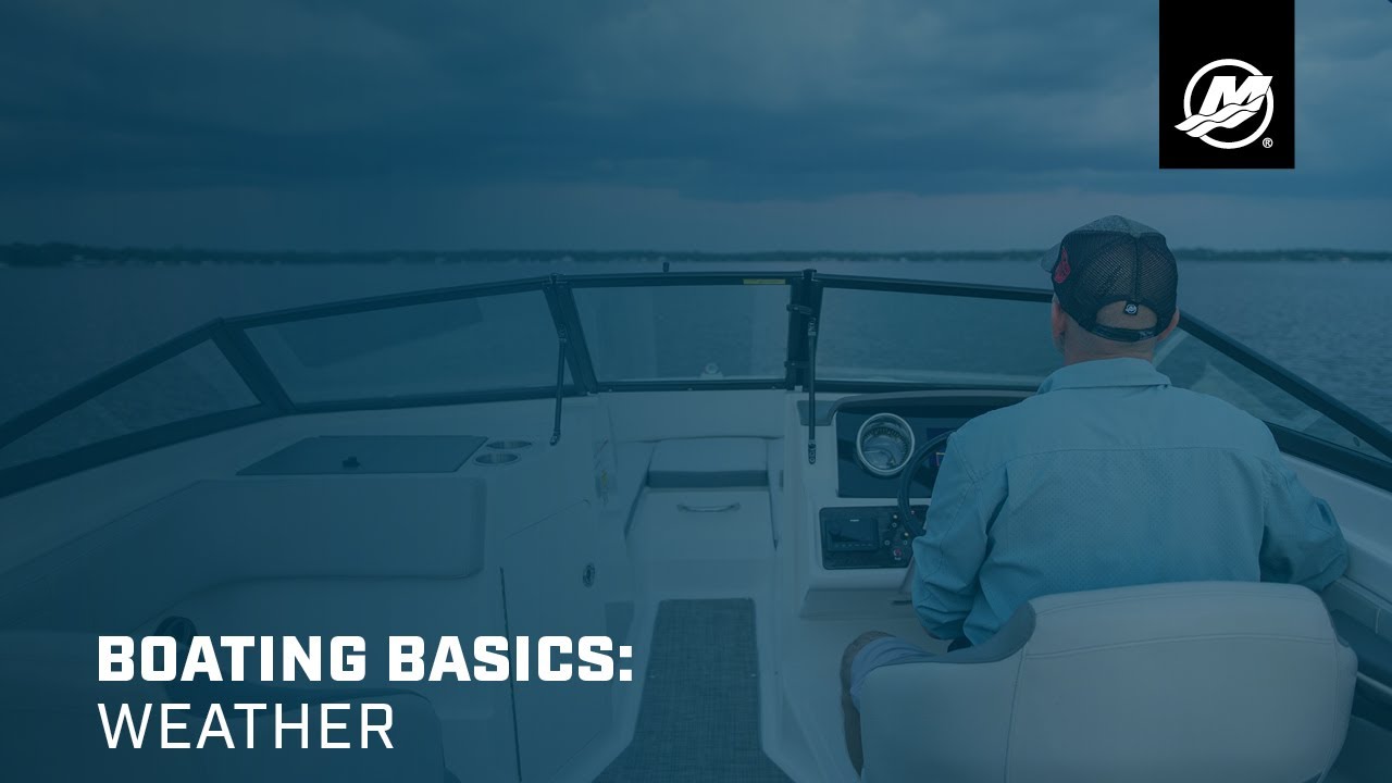 Small boat on calm lake water with wispy clouds in the background.