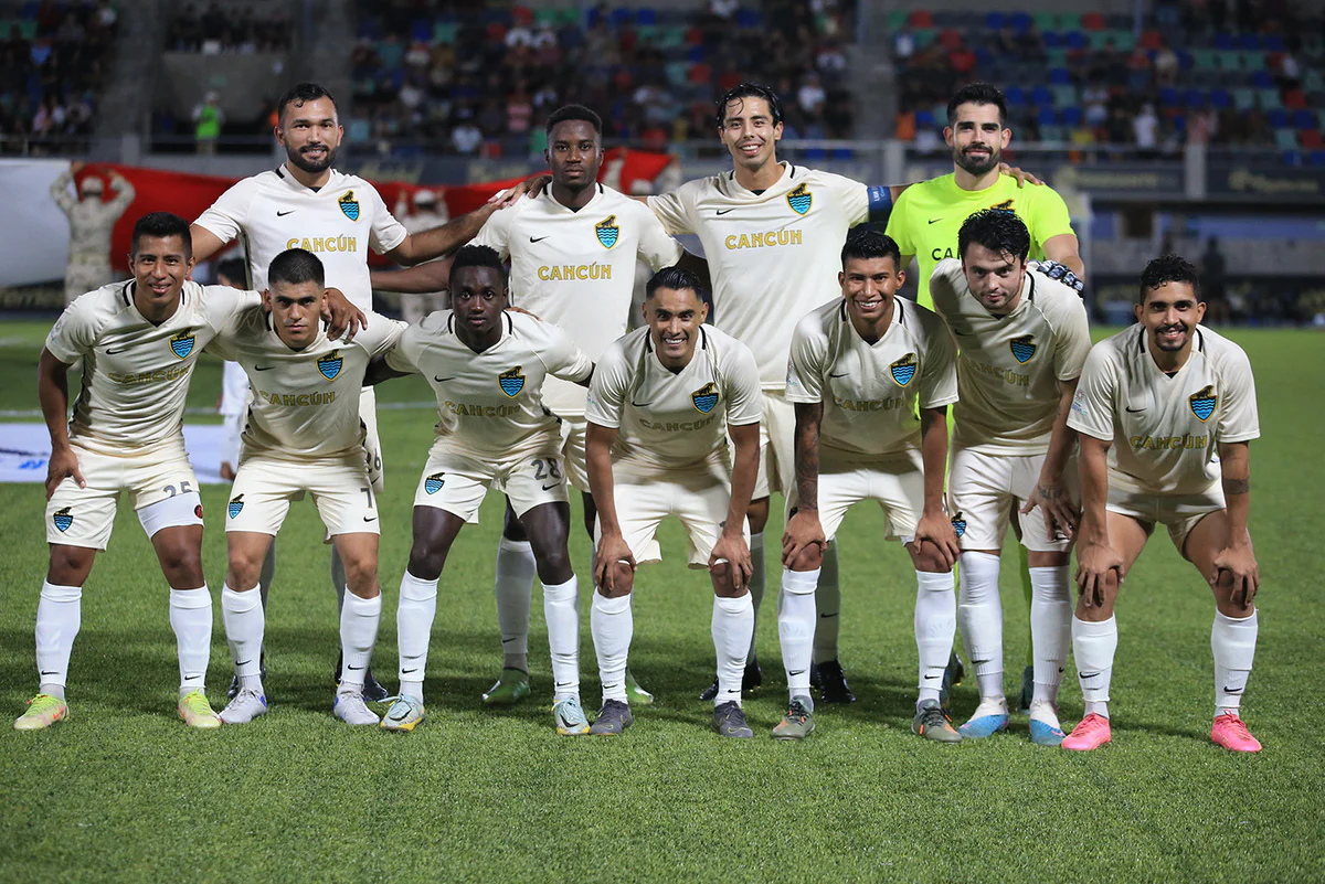 Cancún FC players celebrating their decisive goal during the Copa MX upset victory over Liga MX club Santos Laguna at the Estadio Olímpico Andrés Quintana Roo.