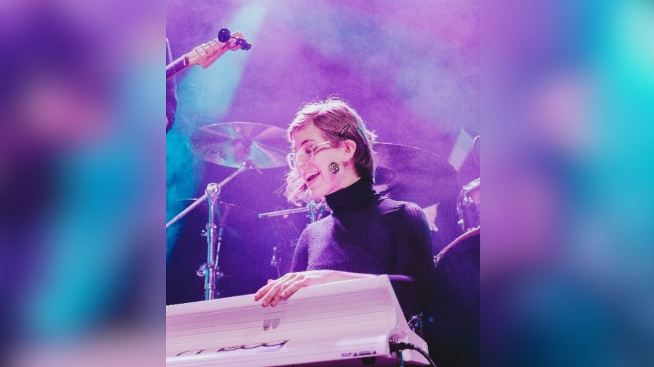 Emma Staake performing acoustic guitar and vocals